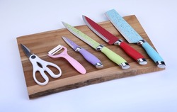 Set of knives for kitchen.  Modern kitchen knives on a table.  New knives on a magnetic board.  Copy space.  Kitchen equipments.