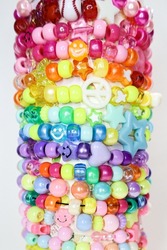 Collection of rainbow beads bracelets on white background