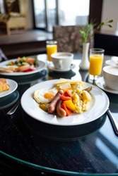 Delicious Breakfast for Two at the Luxury Hotel, Eggs, Sausages, Vegetables, Croissants Coffee, Orange Juice