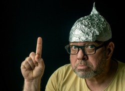 Strange man in a foil hat. Fake news conspiracy theories concept