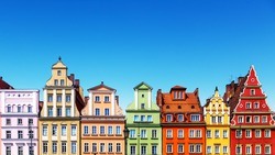 Scenic summer background view of the ancient classic color homes or houses architecture buildings with blue sky in the Old Town of Wroclaw, Poland