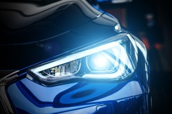Macro view of modern blue car xenon lamp headlight