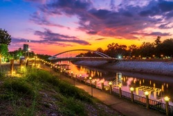 light Bridge over the Nan River (Wat Phra Si Rattana Mahathat also - Chan Palace) New Landmark It is a major tourist is Public places attraction Phitsanulok,Thailand.vivid Twilight dramatic sunset.