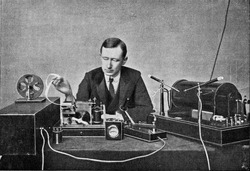 Marconi in front of his receiving device for wireless telegraphy, vintage engraved illustration. From the Universe and Humanity, 1910.