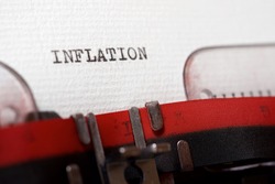 The word inflation written with a typewriter.