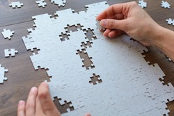 Question mark in the form of puzzles. Task and implementation. Business concepts 