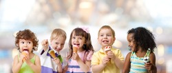 kids group eating ice cream at a party in cafe