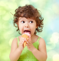 little curly girl with ice cream on colorful background