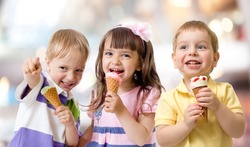 funny children group kidding with ice cream on party