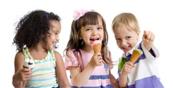 happy kids eating ice cream in studio isolated on white