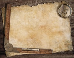 Old treasure map background with compass and wood ruler. Exploration concept.