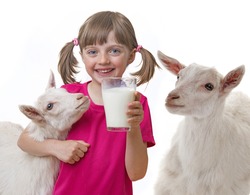 little girl drinking healthy goat milk