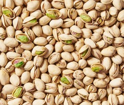 Pistachios texture and background . Tasty pistachios as background,as pistachios  texture. flat lay