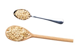 metal and wooden spoon with oat flakes isolated on white background top view.