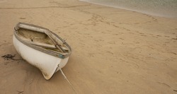 Boat lying on a sandy beach
