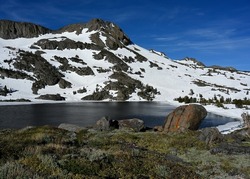 Round Top Mountain rises above Winnemucca Lake in the Mokelumne Wilderness of California.
