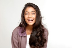 portrait of indian teenager smiling girl over white background