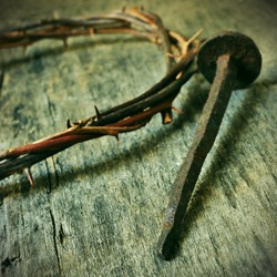 the Jesus Christ crown of thorns and a nail on the Holy Cross