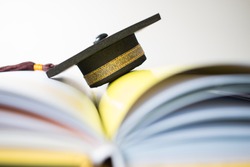Graduation cap on Books step in Library room, Concept of abroad international Educational, Back to School