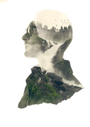 Double exposure silhouette head portrait of a thoughtful man combined with photograph of forest waterfall landscape. Conceptual image showing unity of human with nature. Ecology, freedom, environment