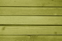 Old grungy wooden planks background in yellow color. Abstract background and texture for design.                      