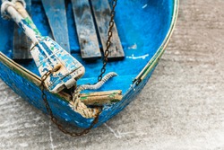 Old blue wooden shabby fishing boat detail. Shot with a selective focus