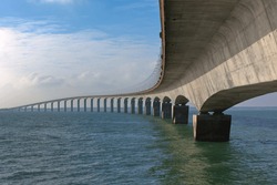 Curved Concrete Bridge over the water. Horizontal shot