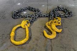 Metal chain with yellow hooks