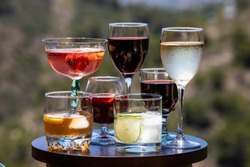 Alcoholic beverages. Different types of alcoholic beverages poured into different types of glasses.