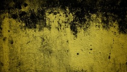 old wall background collaborating yellow and dark colors, old scratched wall unique cracking, old chipped textured wall is popular
