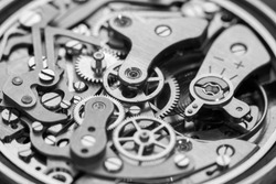 Vintage watch movement close-up. Showing cogs, wheels and jewels.
