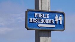 Public Restrooms sign on blue sky in Santa Barbara, California