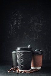 Paper coffee cup with cap mockup on dark background. take away coffee cup mockup,  To go coffee cup  for web design.  Street morning coffee.
