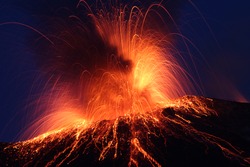 Night eruption volcano Stromboli  Glowing rocks falling down in Phase2