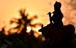 Silhouette picture of lord krishna idol 