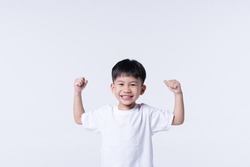 Healthy Asian boy about 4 year olds with strong arm gesture