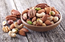 Nuts mix on a wooden background