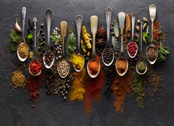 Herbs and spices on graphite background
