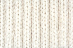Detailed white wool texture background. Rib stitch knitting pattern. 