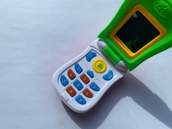 Mobile phone colorful toy on white background, Kids toy