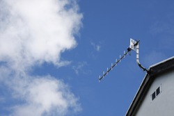 Tv aerial on the roof of a house