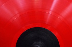 Red bright vinyl record close-up
