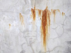 red rust leaks on concrete wall texture.