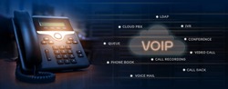 VOIP services concept of ip telephone device on work place, blurred data center with server racks, cloud icon with services words of voip