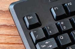 close up of esc button computer keyboard on office desk