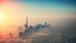 Aerial view of Dubai city in sunset light. Panoramic view. Dubai is the biggest and most modern city in UAE.
