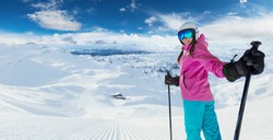 Young caucasian woman skier in European Alps. Winter sports and leasure activities