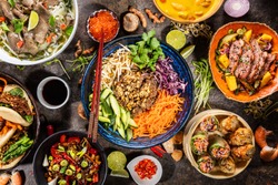 Top view composition of various Asian food in bowls, free space for text
