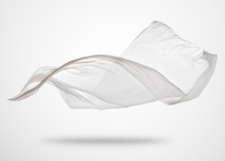 Smooth elegant transparent white cloth separated on gray background. Texture of flying fabric.
