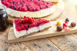 cheesecake vanilla cake with fruity raspberry jam with different berries